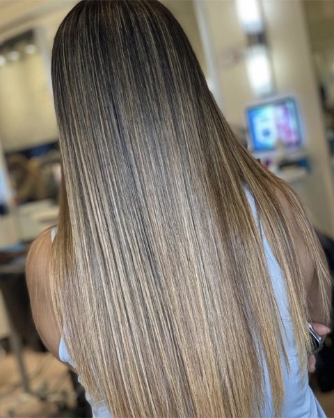 Healthy, vibrant hair showing the result of the Artysto Bond Stand-Alone Treatment for strength and elasticity.