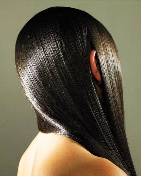 Healthy, dark hair showing the result of the Artysto Bond Strengthening Ritual, restoring resilience, vitality, and shine.