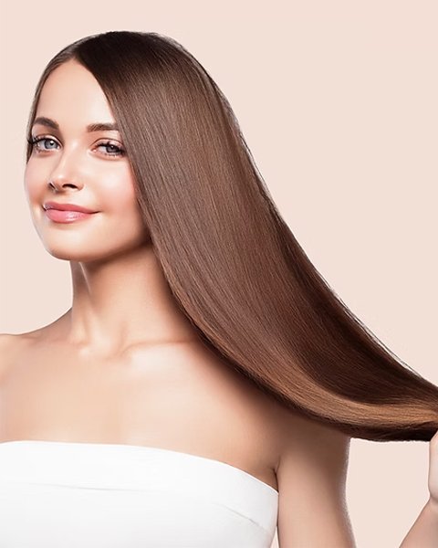 Woman showing off the result of Artysto Salon Hair Botox Treatment with smooth, shiny, straight, and revitalized hair.