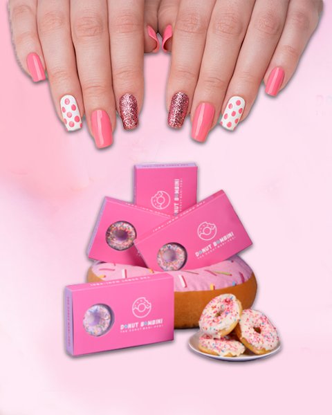 Hands with polished nails next to Ice Cream Manicure products, highlighting the creamy, dessert-inspired formula.