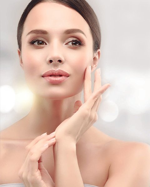 Woman showcasing smooth, rejuvenated skin after the Infinity Youth Advanced Anti-Aging Facial, promoting wrinkle reduction and a lasting youthful glow.