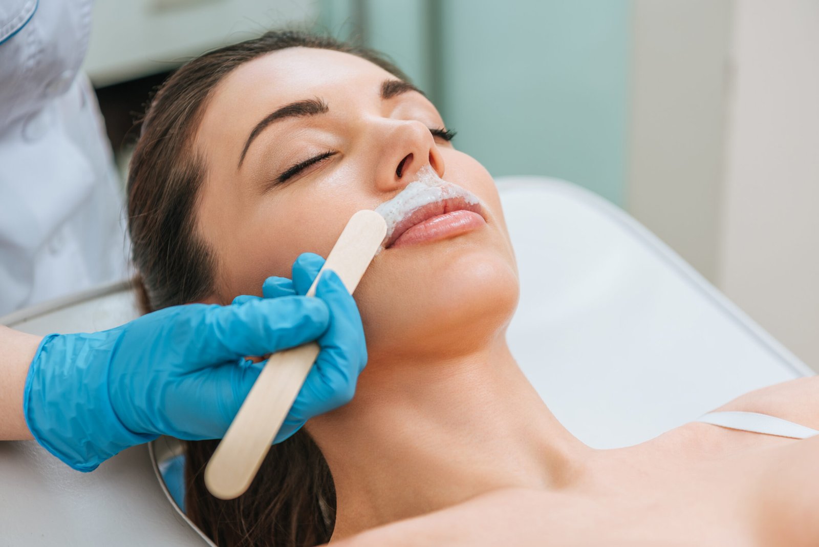 Close-up of a technician performing quick, gentle Upper Lip Waxing, delivering precise hair removal and a smooth, polished finish.