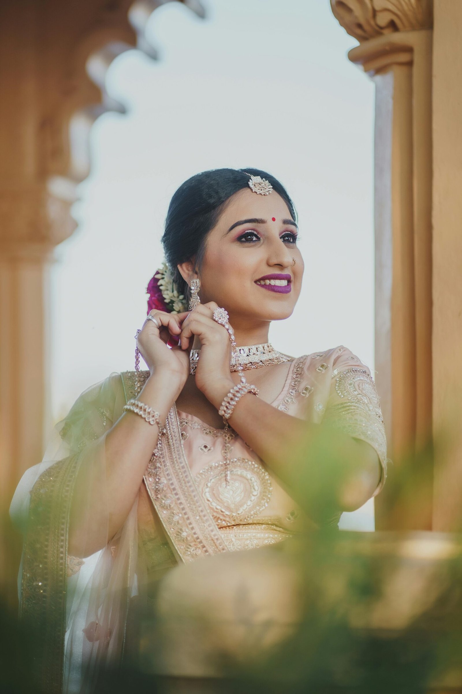 Stunning Indian bride with flawless, long-lasting Bridal Makeup and elegant jewelry, ready for her wedding day in Coimbatore.