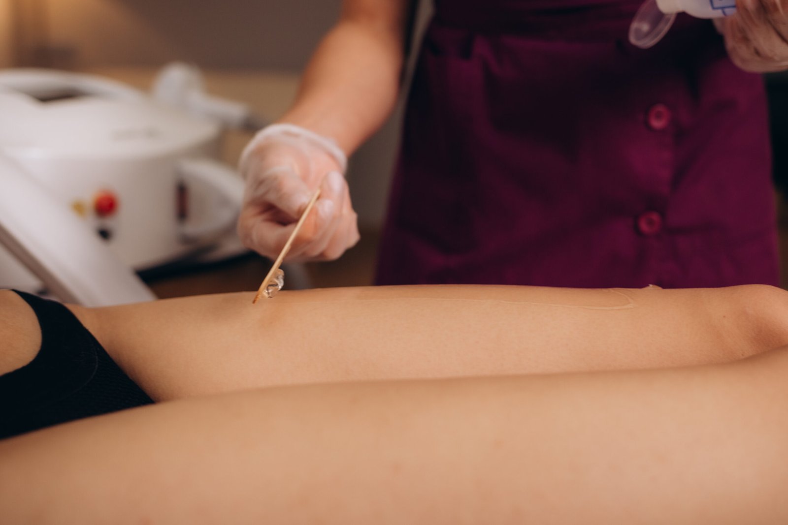 Professional technician preparing a client for hygienic Bikini or Brazilian Waxing, designed for precision and comfort.